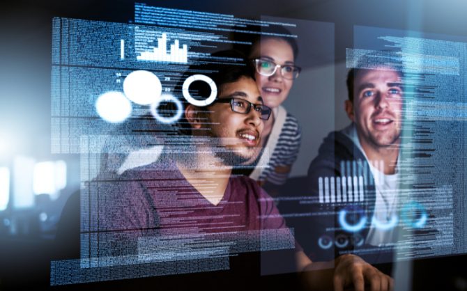 a team in front of a computer