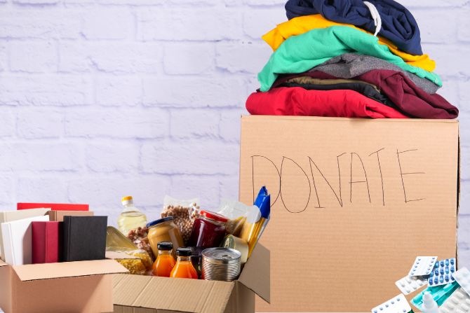 Boxes of donated goods including clothing, food, books, and medicine, representing items exempt from U.S. tariffs in 2025.