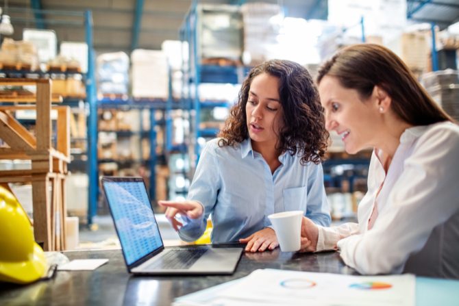 Ai in logistics can help two women in a warehouse do better inventory management