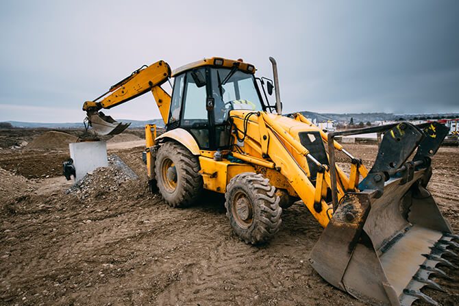 a tractor caving the ground